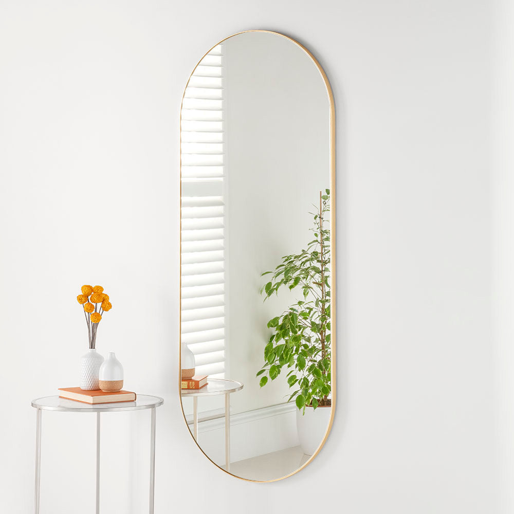 Tall slim framed oval mirror in gold