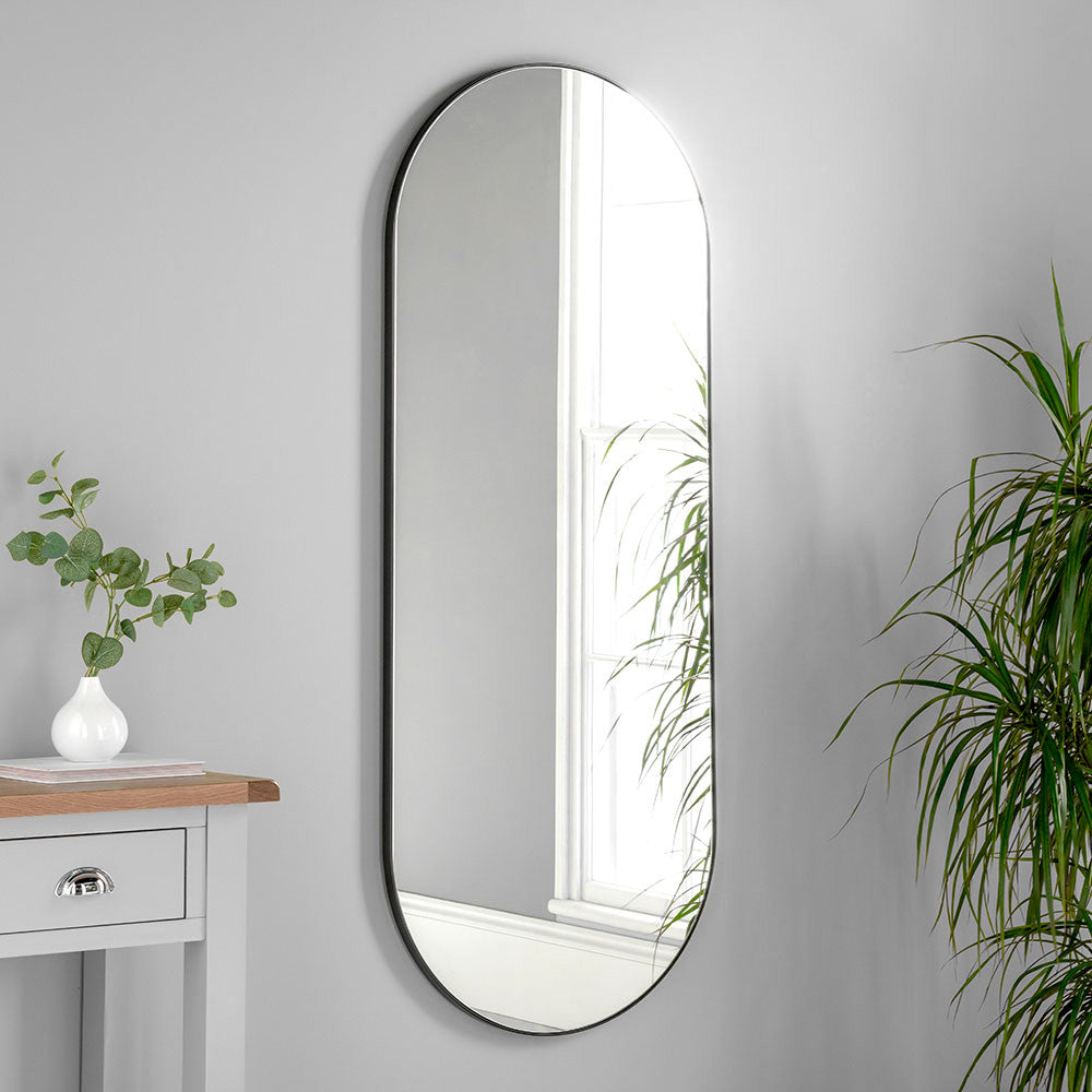 tall full length oval mirror with slim black frame