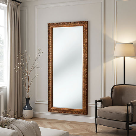 Decorative mirror with gold frame in a living room setting