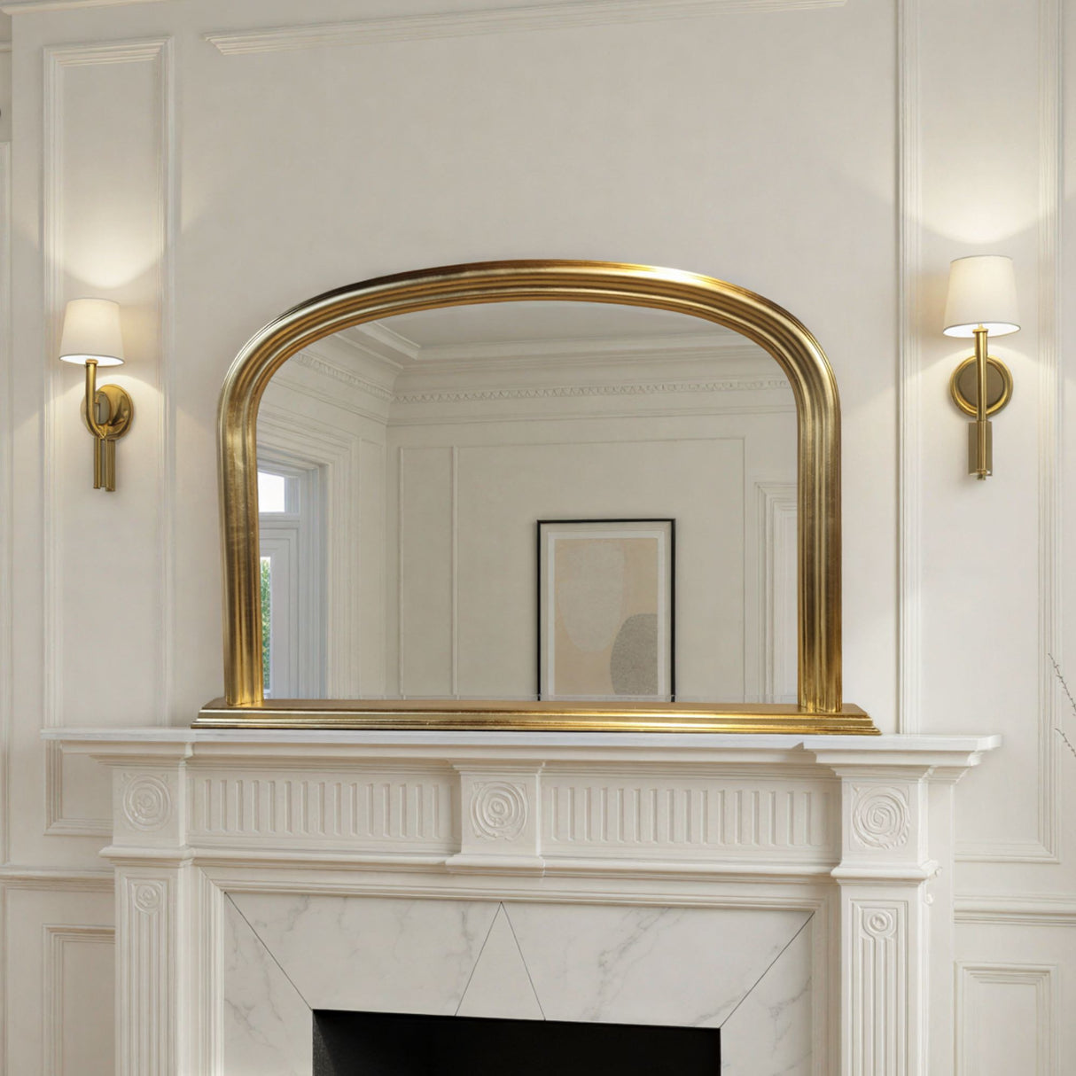 Gold-framed mirror above a white fireplace with decorative molding.
