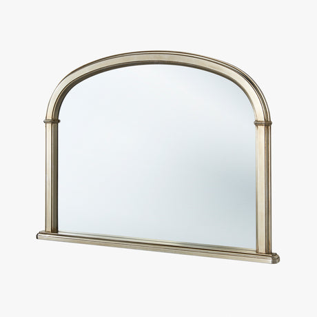 Arch-shaped mirror with a metallic frame on a white background