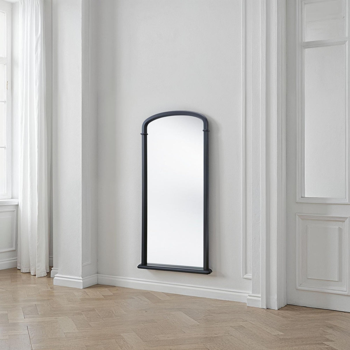 Tall curved refined arch mirror