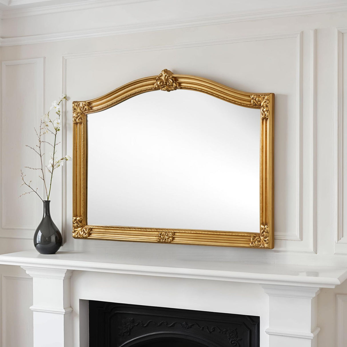 Arched carved overmantle gold