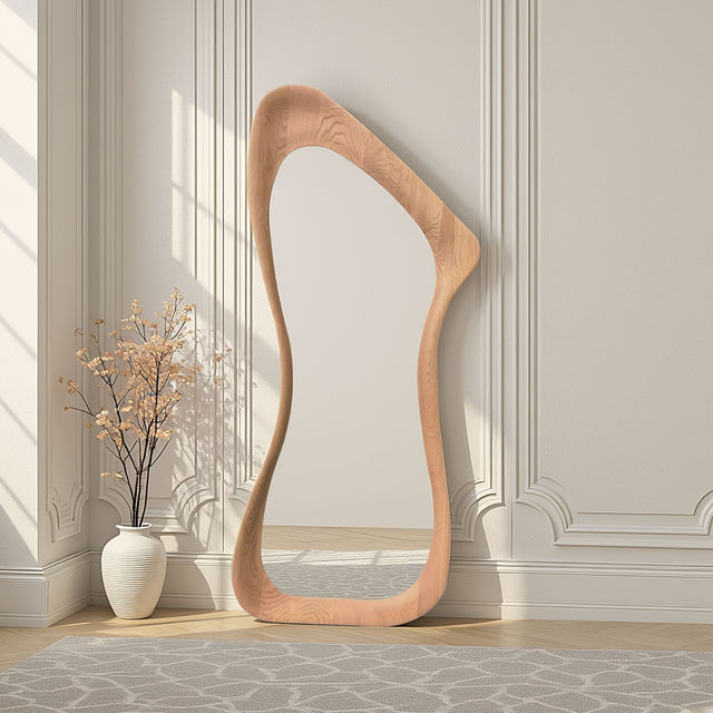 Wooden floor mirror with a unique design in a room with decorative wall molding.