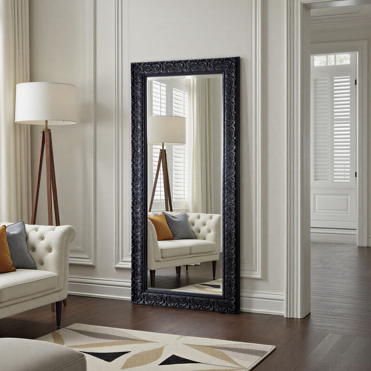 Large decorative mirror in a living room with a lamp and sofa.