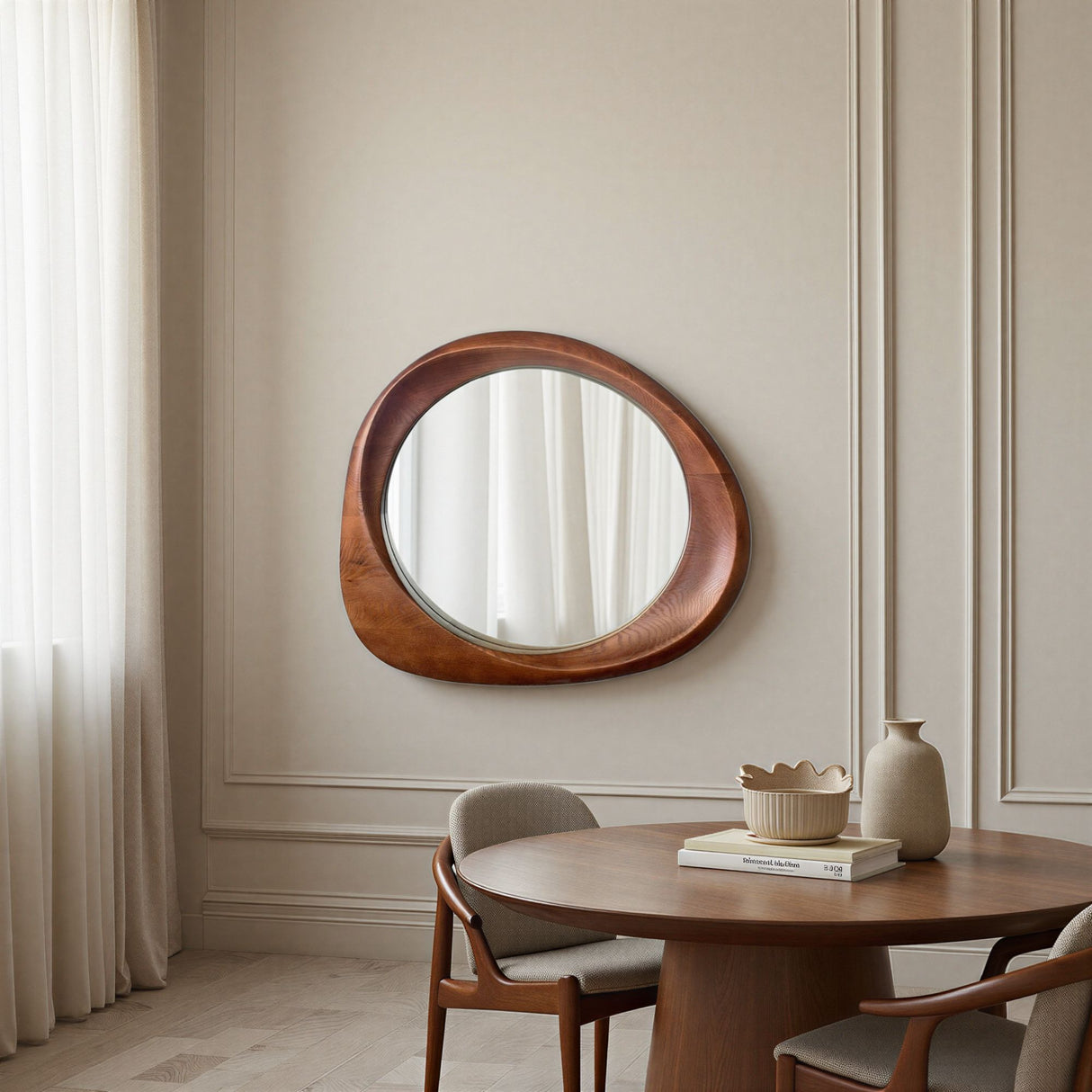 Round wooden mirror on a wall above a dining table with chairs.