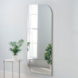 Gold irregular rectangular curved edge minimal frame glass mirror